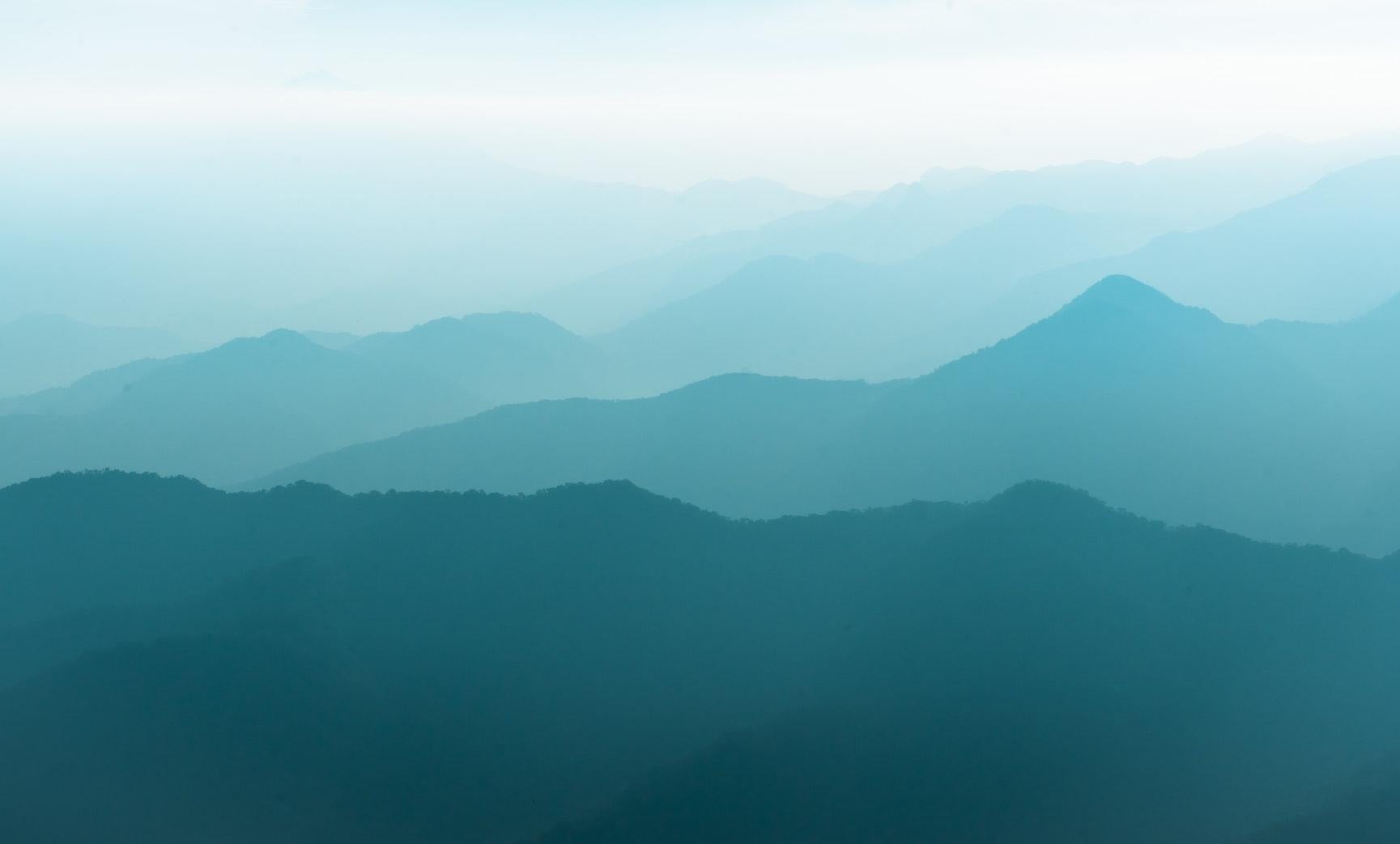 A series of mountains vanishing in the distance