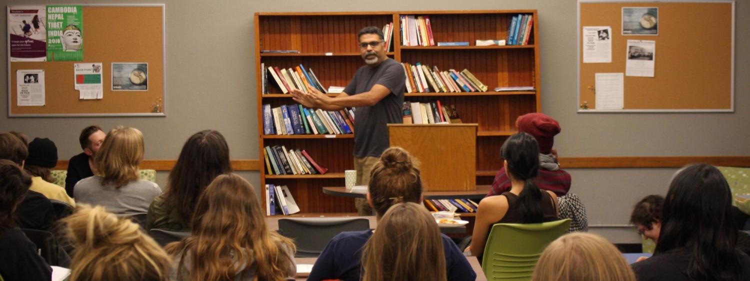 Ali Hasan reading to the attendees 