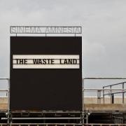 A cinema sign that reads, "Waste Land"
