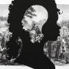 Silhouette of a woman over a landscape