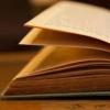 An open book lying on a table