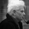 A man smoking a tobacco pipe