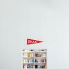 Red read banner above a bookshelf