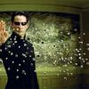 A man holding his hand out with bullets flying at him