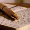 A fountain pen resting on an open book
