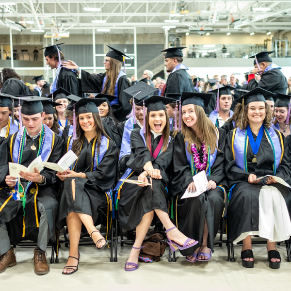 Graduating ENVD students sit down at commencement
