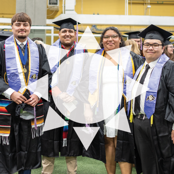 Symbol of a sun in front of a group of ENVD graduates