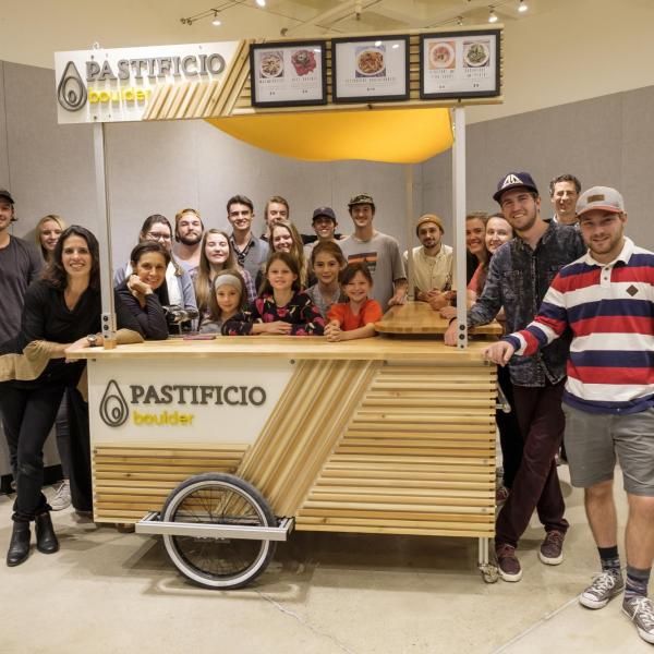 Senior Instructor Jade Polizzi's design-build class poses with final-built pasta cart.