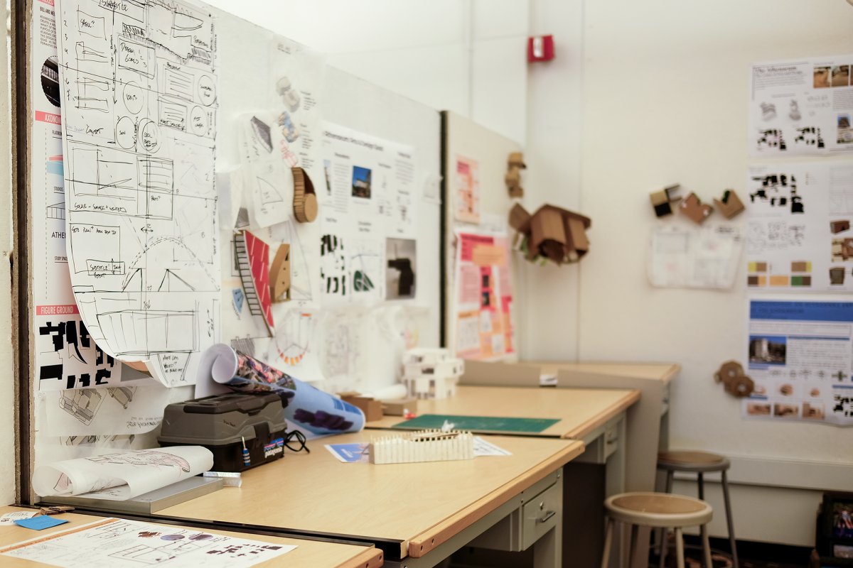 ENVD studio desks and student work pinned on wall
