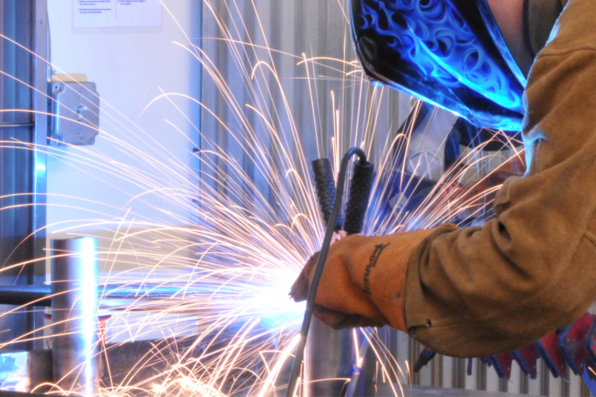 Student welding in the Creative Labs Center