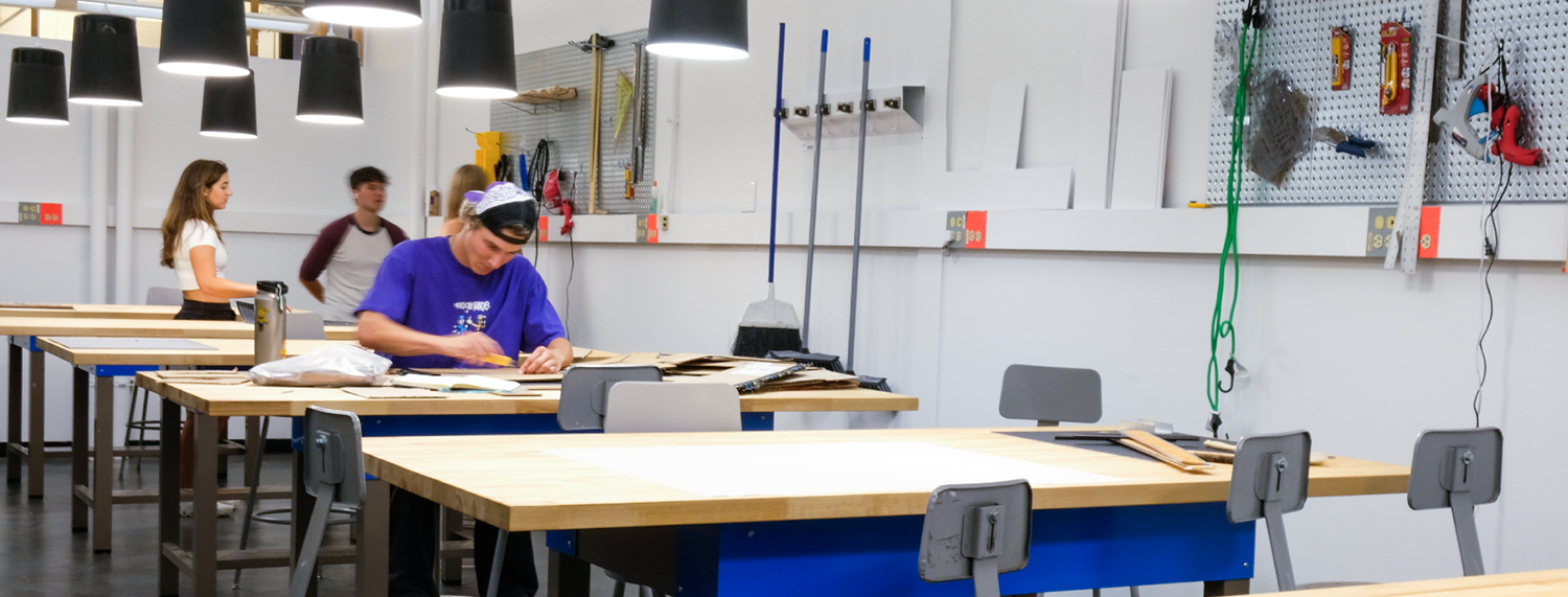 Student works on drafting desks in ENVD studio