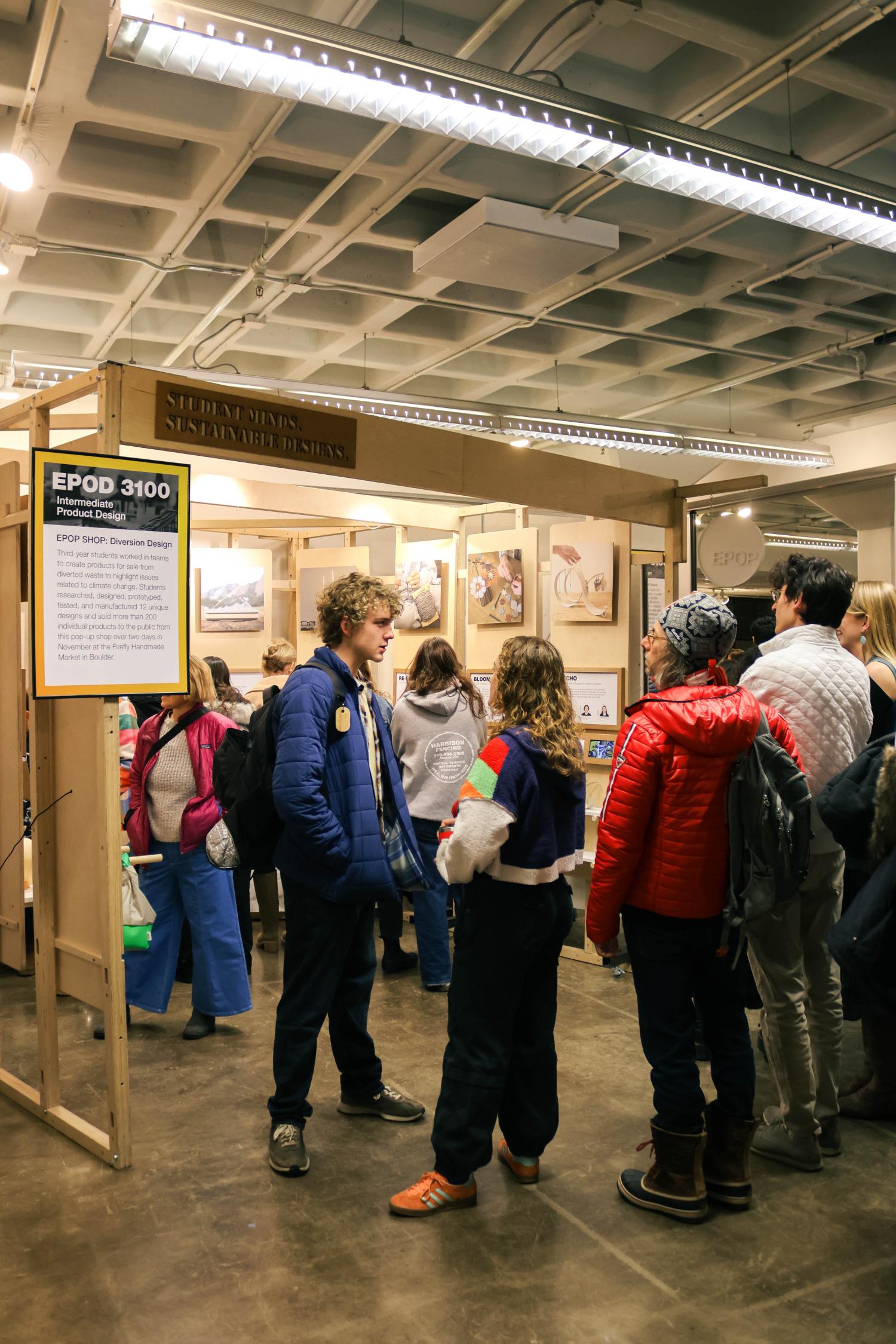 Open House visitors look at student work
