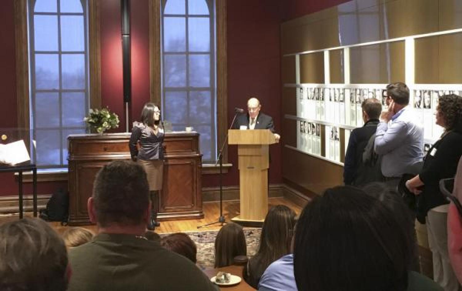 Sheryl Koutsis stands beside CU Chancellor to receive distinguished annual Chancellor’s Employee of the Year Award.