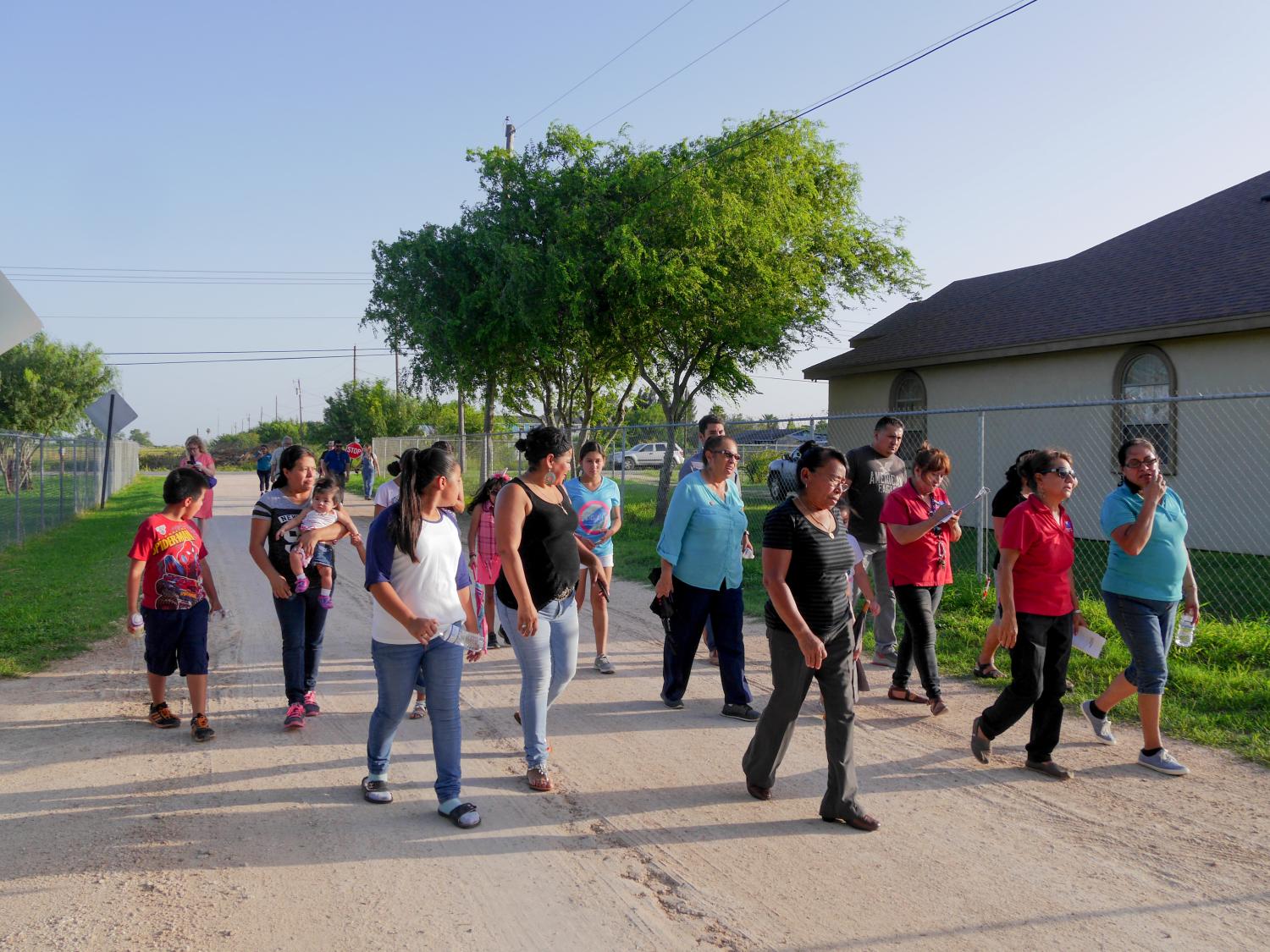 Colonias Residents walk along the neighborhood streets in Brownsville, Texas.