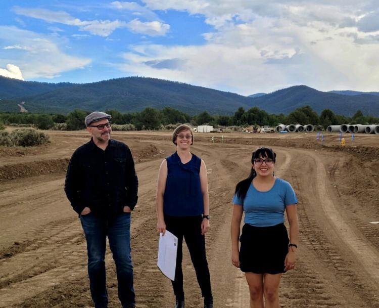 Ferguson, Pyatt, and Masani stand at the worksite.