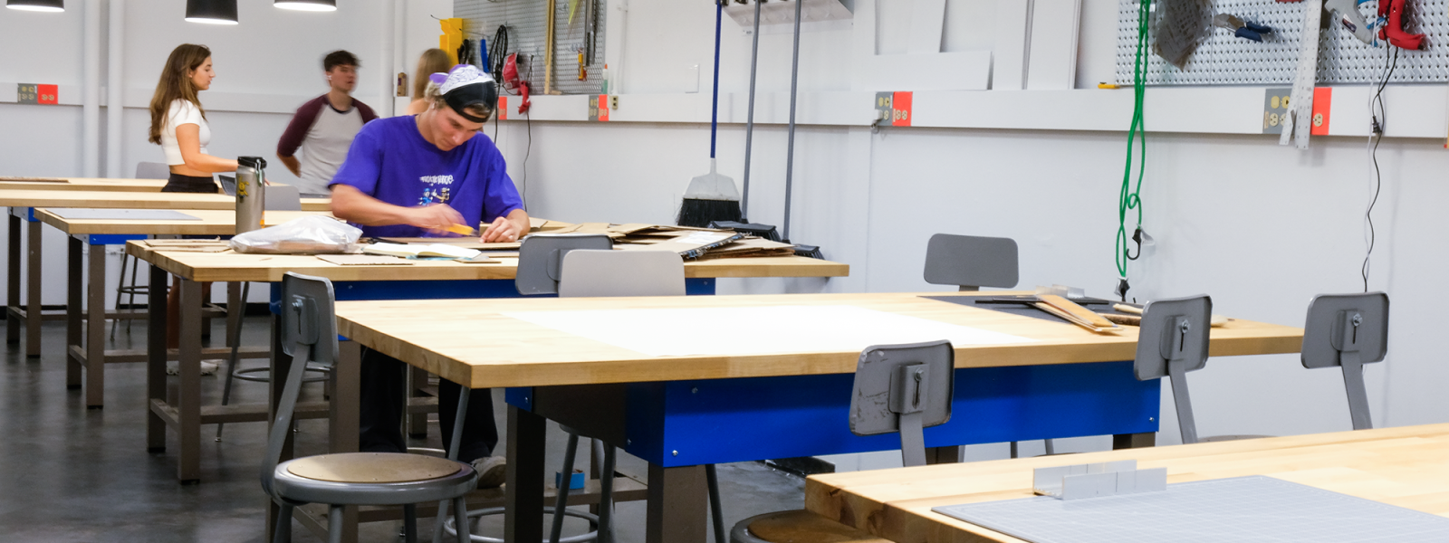 Students work at studio desks