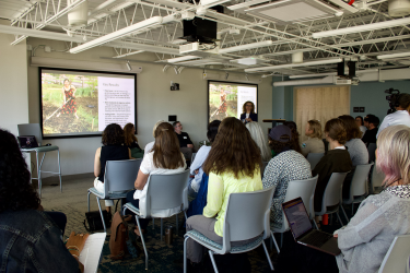 Professor Jill Litt presents a slideshow to the attendees