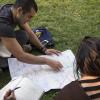 Assistant Professor, Alicia Gonzales and Kristina Lu view a map of Santiago