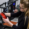 Student working with 3D printer