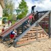 Children playing on a playground built by 18 student in the Program of Environmental Design in Lakewood, Colorado.