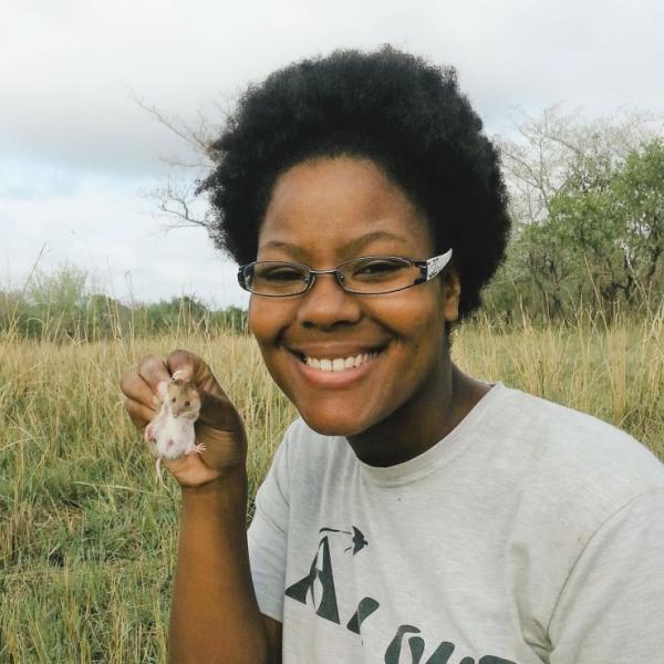 Karen Bailey holding a field mouse
