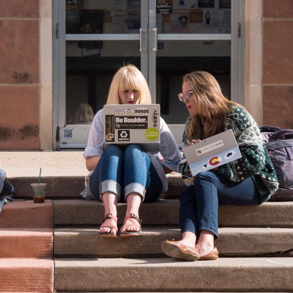 students studying on the steps