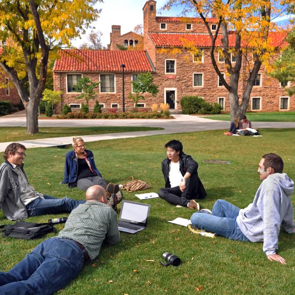 students studying outside in a circle