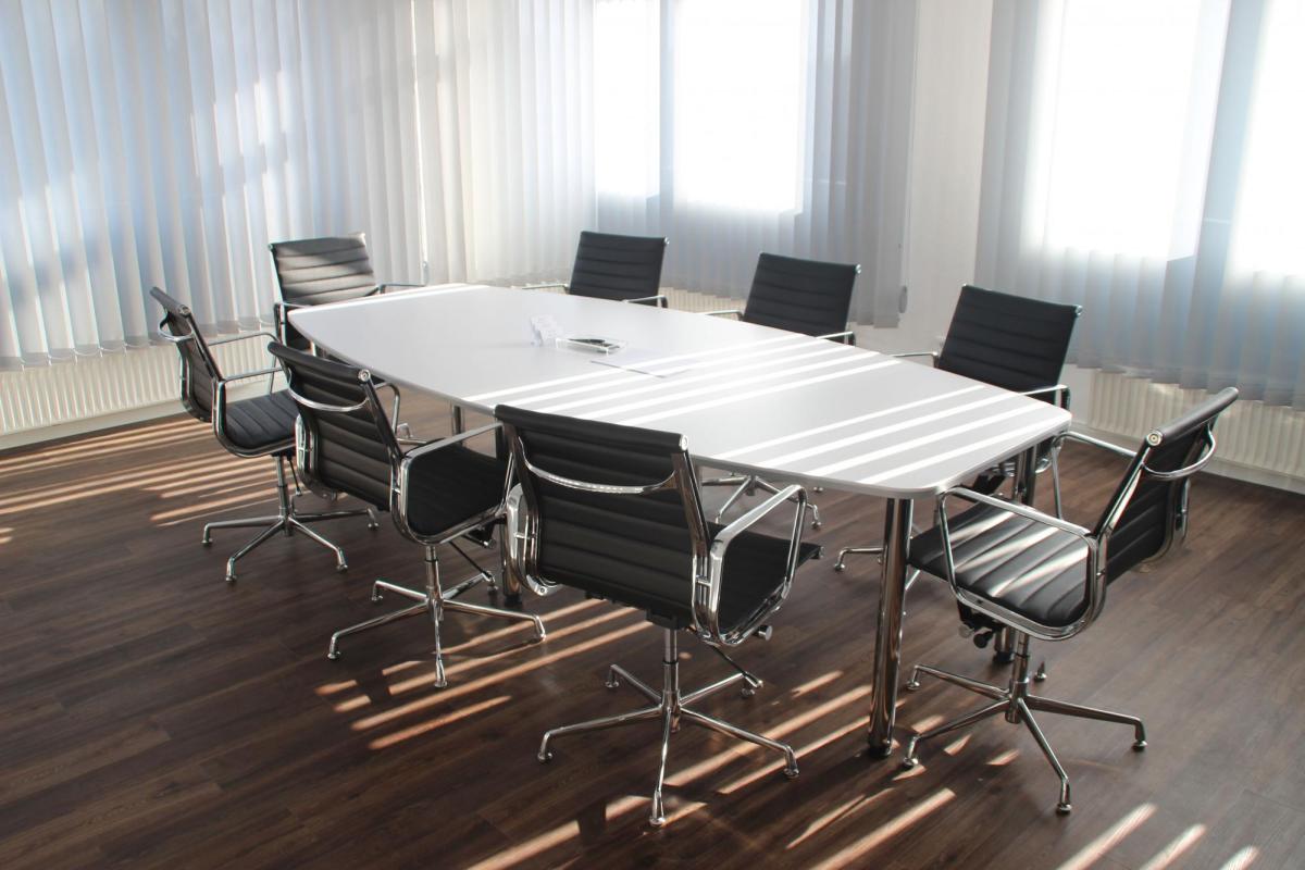 Image of an empty conference table.
