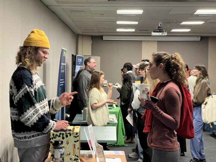 Two people talking at career expo