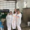 three students stand together auditing waste at vail
