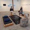 Fernandes and McAuliffe sitting in a exhibit