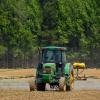 An agricultural field is sprayed with fertilizer or pesticides. (Credit: John Lambeth / Pexels)