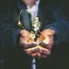 Man holding incandescent bulb