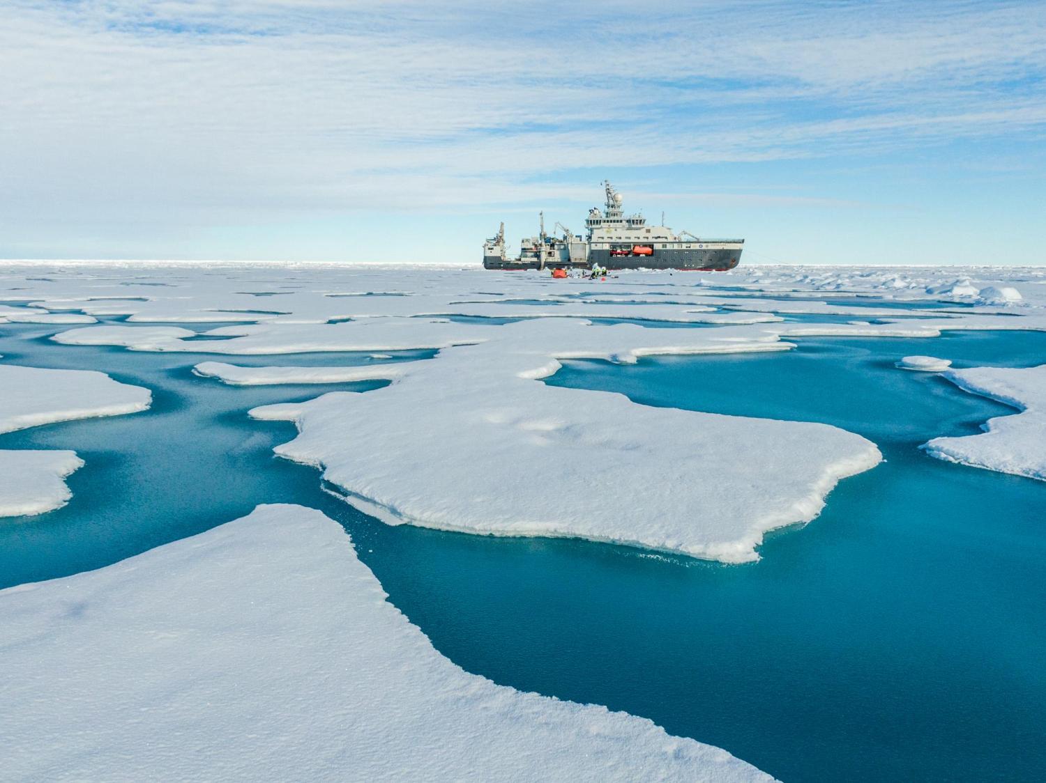 The ship in the distance on an ice floe.