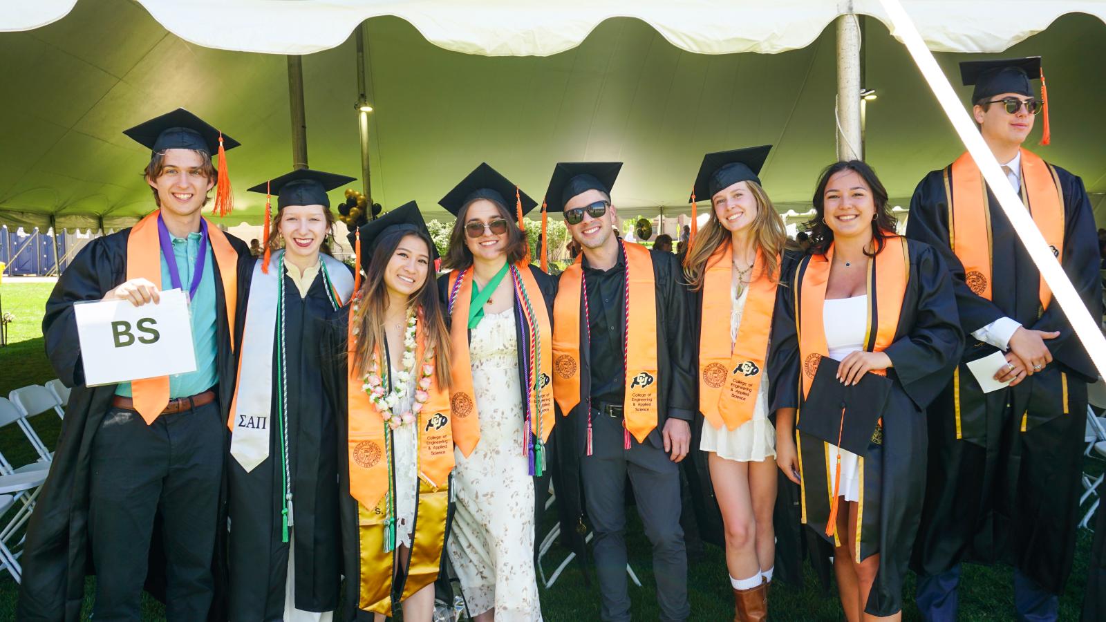 Students in caps and gowns.
