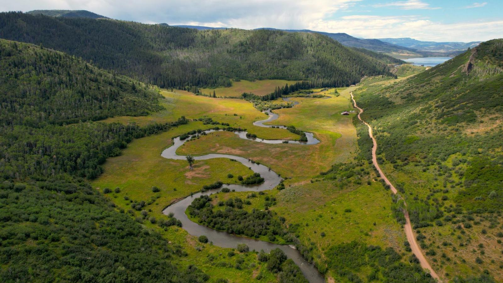 Aerial photo of a winding stream in the mountains.