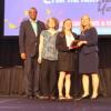 Bielefeldt and Polmear receive their award onstage