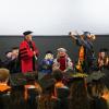 A student celebrating graduation.