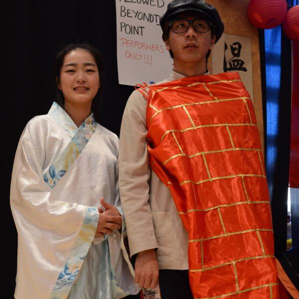 Two Japanese students dressed in their traditional attire.