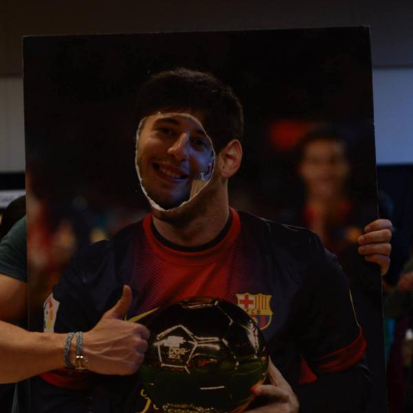 Lionel Messi's face cut picture at Catalonian booth.