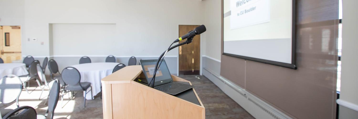 Podium with laptop and microphone set-up