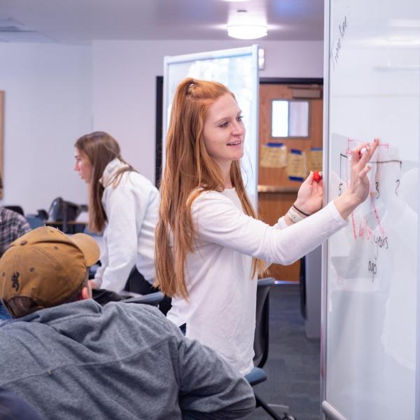 student on whiteboard