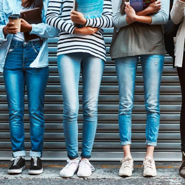 People standing together in front of a garage door.