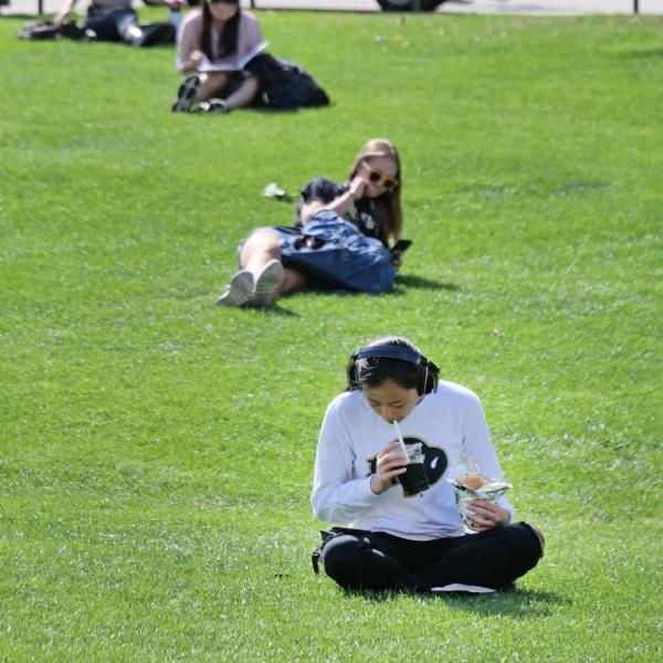 Students relax on the physics lawn between classes