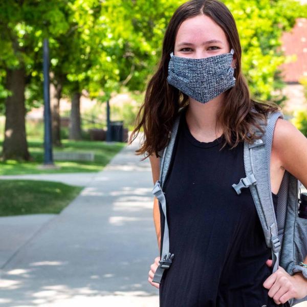 Student wearing a mask on campus.