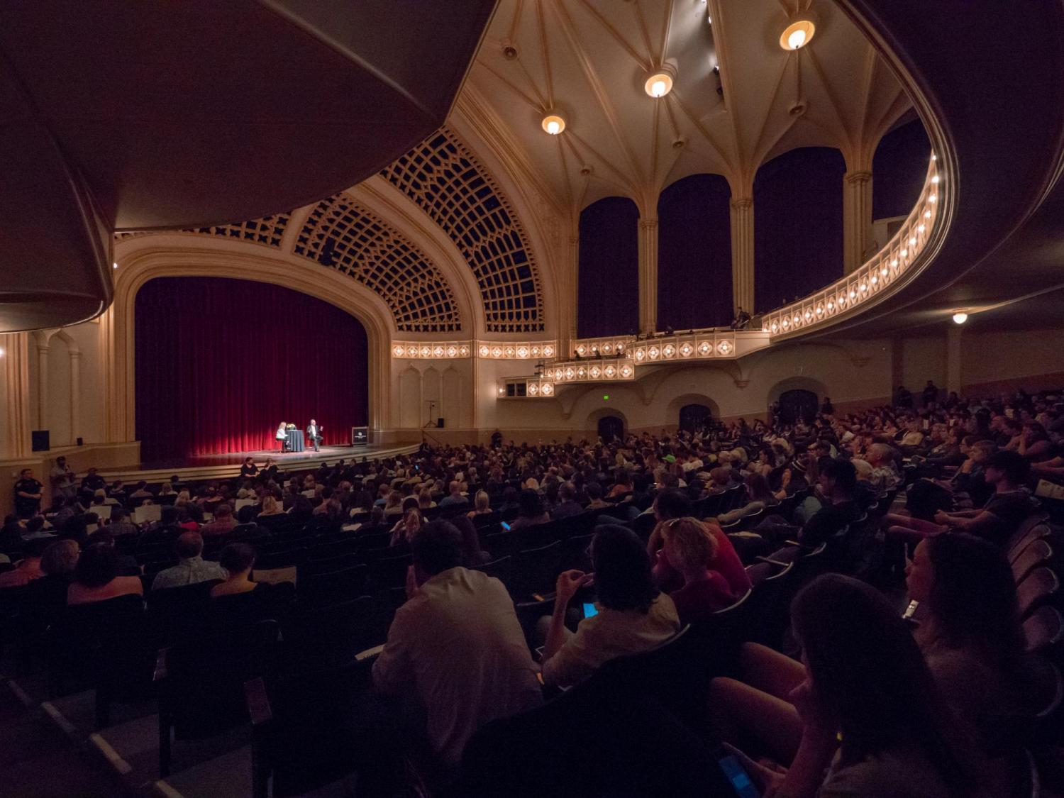 Attendees listen in during a lecture at Macky Auditorium