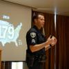 Police officer addressing a class.