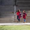 Two students walking on campus