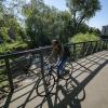 Woman riding a bike.