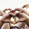 people making hearts with their hands